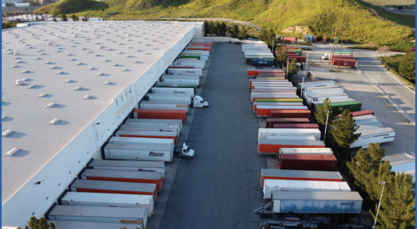 warehouse with semi-trucks outside