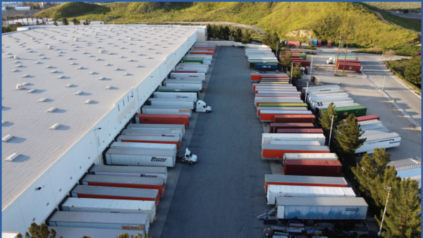 warehouse with semi-trucks outside