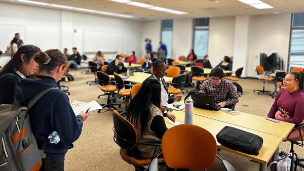 Researchers in a room sitting and talking